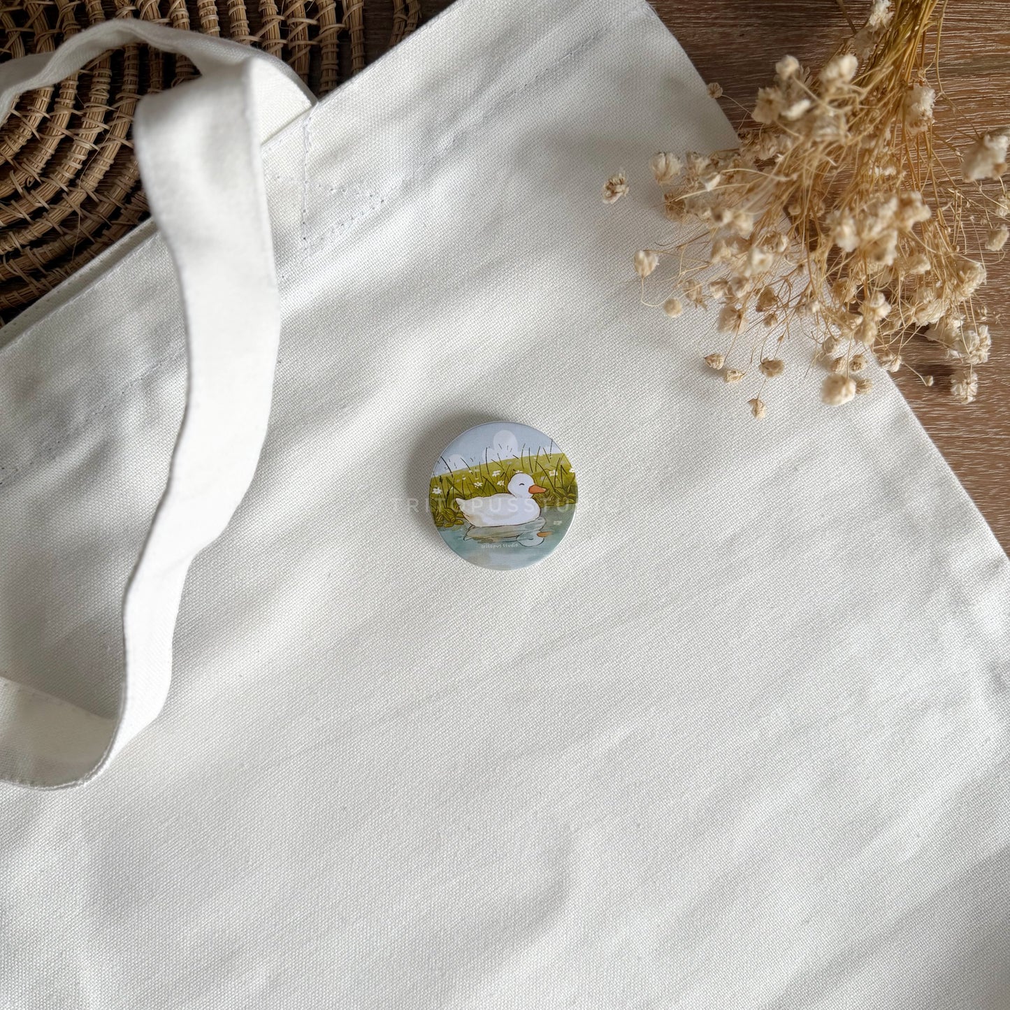 playful duckling button badge 44mm