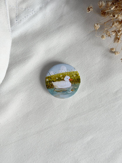 playful duckling button badge 44mm